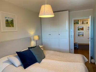 Ein Bett oder Betten in einem Zimmer der Unterkunft Residenz Darssblick