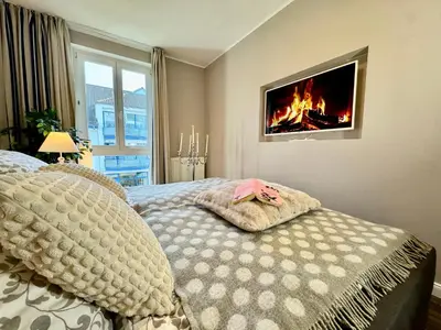 Ein Bett oder Betten in einem Zimmer der Unterkunft Ferienwohnung Nr 124 Sehnsucht-Zingst