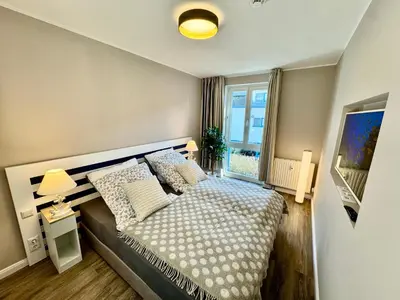 Ein Bett oder Betten in einem Zimmer der Unterkunft Ferienwohnung Nr 124 Sehnsucht-Zingst