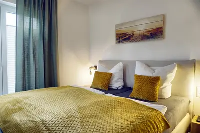 Ein Bett oder Betten in einem Zimmer der Unterkunft Haus Seevogel - Suite Schwalbe - a64984