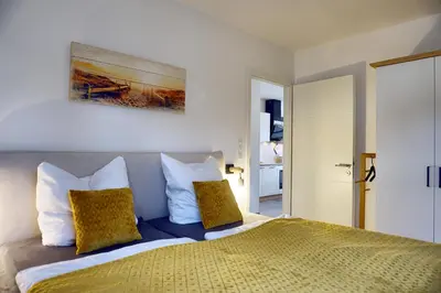 Ein Bett oder Betten in einem Zimmer der Unterkunft Haus Seevogel - Suite Schwalbe - a64984