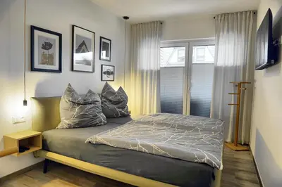 Ein Bett oder Betten in einem Zimmer der Unterkunft Haus Seevogel - Suite Schwalbe - a64984