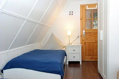 Ein Bett oder Betten in einem Zimmer der Unterkunft Reethus