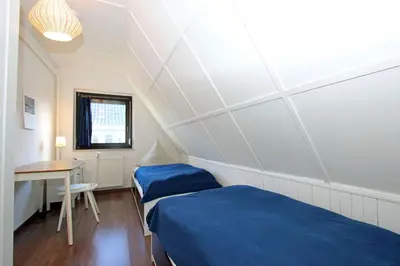 Ein Bett oder Betten in einem Zimmer der Unterkunft Reethus