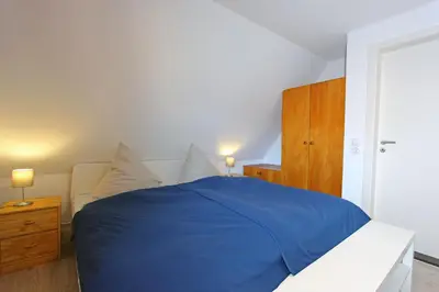 Ein Bett oder Betten in einem Zimmer der Unterkunft Brücke im Reethus