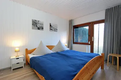Ein Bett oder Betten in einem Zimmer der Unterkunft Kajüte im Reethus