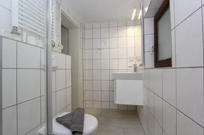 Ein Badezimmer in der Unterkunft Kajüte im Reethus
