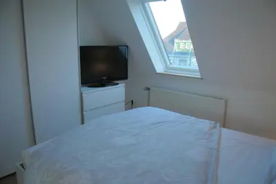 Ein Bett oder Betten in einem Zimmer der Unterkunft FischLANDinSicht