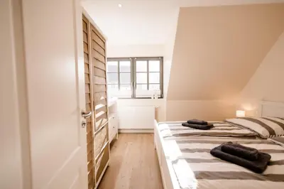 Ein Bett oder Betten in einem Zimmer der Unterkunft Ferienhaus Meeresschatz
