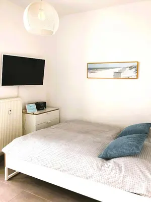 Ein Bett oder Betten in einem Zimmer der Unterkunft App 134Haus 3