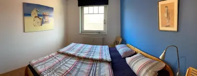 Ein Bett oder Betten in einem Zimmer der Unterkunft Friedensstraße 41 Wohng 12