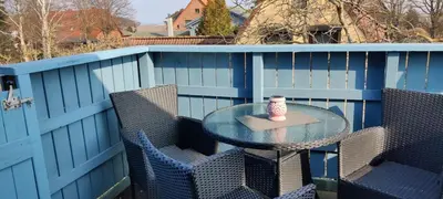 Ein Balkon oder eine Terrasse in der Unterkunft Ferienwohnung im Rohrdachhaus