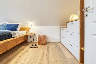 Ein Bett oder Betten in einem Zimmer der Unterkunft Rosenberg 13 Wohnung 1d DG re