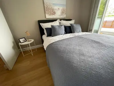 Ein Bett oder Betten in einem Zimmer der Unterkunft Wohnen am Meer