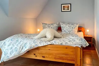 Ein Bett oder Betten in einem Zimmer der Unterkunft Ferienhaus Friederike