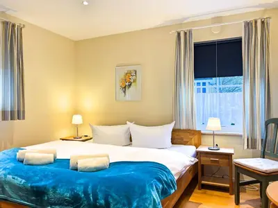 Ein Bett oder Betten in einem Zimmer der Unterkunft In den Wiesen App 3
