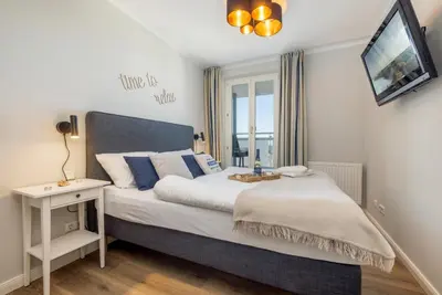 Ein Bett oder Betten in einem Zimmer der Unterkunft Suite Meer & mehr
