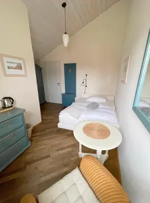 Ein Bett oder Betten in einem Zimmer der Unterkunft Pension Walfischhaus