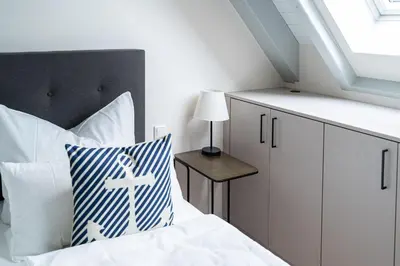 Ein Bett oder Betten in einem Zimmer der Unterkunft Haus Sandnelke - Domizil am Ostseewald