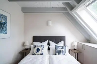 Ein Bett oder Betten in einem Zimmer der Unterkunft Haus Löwenzahn - waldnah mit Kamin & Sauna