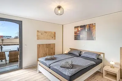 Ein Bett oder Betten in einem Zimmer der Unterkunft Speicher Hafendomizil