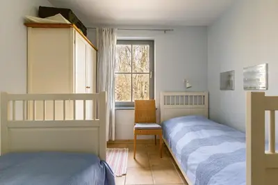 Ein Bett oder Betten in einem Zimmer der Unterkunft Strandhaus Wustrow - Wohnung 1