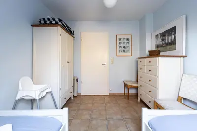 Ein Bett oder Betten in einem Zimmer der Unterkunft Strandhaus Wustrow - Wohnung 3