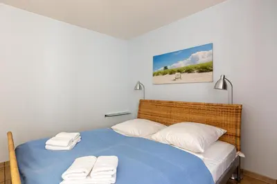Ein Bett oder Betten in einem Zimmer der Unterkunft Strandhaus Wustrow - Wohnung 4