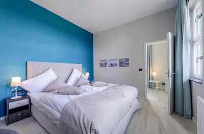 Ein Bett oder Betten in einem Zimmer der Unterkunft Panorama-Utkiek inklusive Strandkorb von April-Oktober