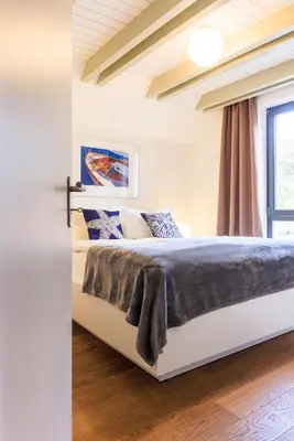 Ein Bett oder Betten in einem Zimmer der Unterkunft Akelei - Sauna, Kamin & Balkon