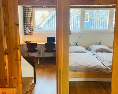 Ein Bett oder Betten in einem Zimmer der Unterkunft Austernfischer Prerow - Schönes Ferienhaus in Toplage mit großem Garten für Familie und Freunde