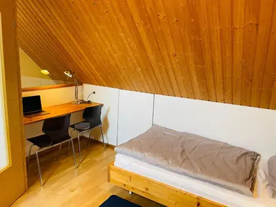 Ein Bett oder Betten in einem Zimmer der Unterkunft Austernfischer Prerow - Schönes Ferienhaus in Toplage mit großem Garten für Familie und Freunde