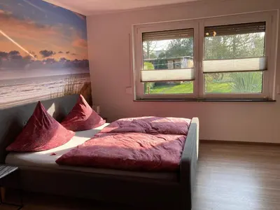 Ein Bett oder Betten in einem Zimmer der Unterkunft Ferienwohnung OstseeStrandLäufer 1