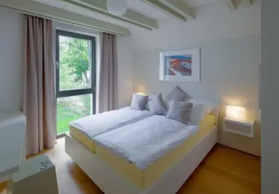 Ein Bett oder Betten in einem Zimmer der Unterkunft FW Blaustern - Sauna, Kamin & Terrasse