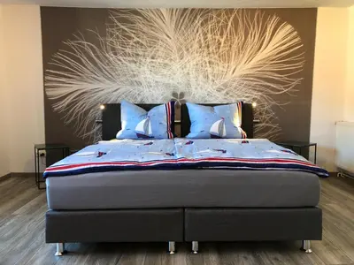 Ein Bett oder Betten in einem Zimmer der Unterkunft Ferienwohnung OstseeStrandLäufer 2