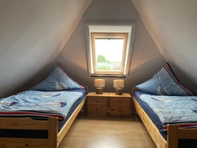 Ein Bett oder Betten in einem Zimmer der Unterkunft Ferienwohnung OstseeStrandLäufer 2