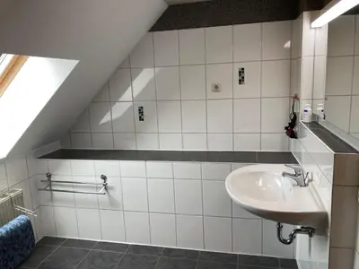 Ein Badezimmer in der Unterkunft Ferienwohnung OstseeStrandLäufer 2