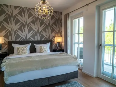 Ein Bett oder Betten in einem Zimmer der Unterkunft Panorama-Residenz 26