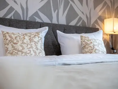 Ein Bett oder Betten in einem Zimmer der Unterkunft Panorama-Residenz 26