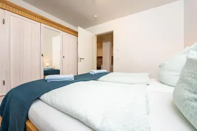 Ein Bett oder Betten in einem Zimmer der Unterkunft Ferienwohnungen am Darßer Ort inkl Wäschepaket