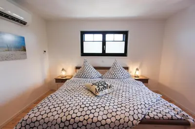 Ein Bett oder Betten in einem Zimmer der Unterkunft Nordlichter - Speicher Residenz