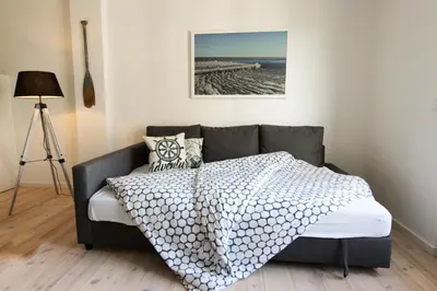 Ein Bett oder Betten in einem Zimmer der Unterkunft Nordlichter - Speicher Residenz