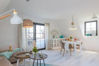 Ein Sitzbereich in der Unterkunft Ferienwohnungen Haus am Strand