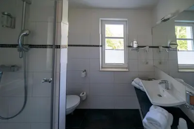Ein Badezimmer in der Unterkunft Hotel & Café Strandeck