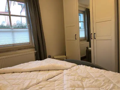 Ein Bett oder Betten in einem Zimmer der Unterkunft Hus Sünnschien Wg 1