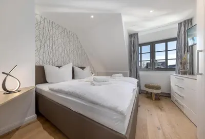 Ein Bett oder Betten in einem Zimmer der Unterkunft Ferienhaus OstseeLust