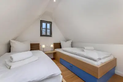 Ein Bett oder Betten in einem Zimmer der Unterkunft Ferienhaus OstseeLust