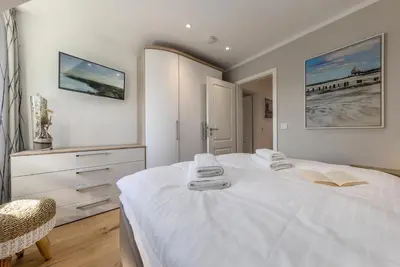 Ein Bett oder Betten in einem Zimmer der Unterkunft Ferienhaus OstseeLust