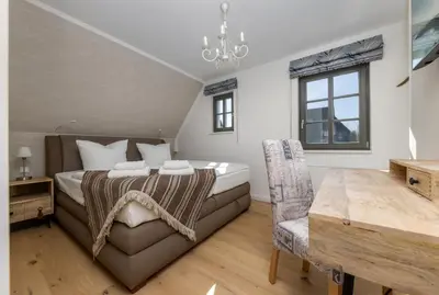 Ein Bett oder Betten in einem Zimmer der Unterkunft Ferienhaus OstseeLust