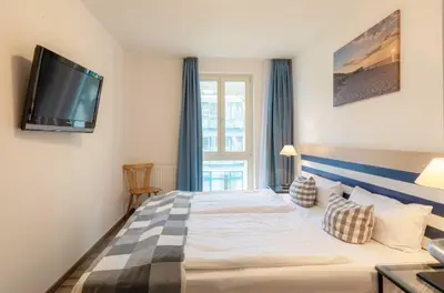 Ein Bett oder Betten in einem Zimmer der Unterkunft Leuchtturm